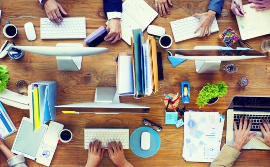 Group of Business People Working on an Office Desk