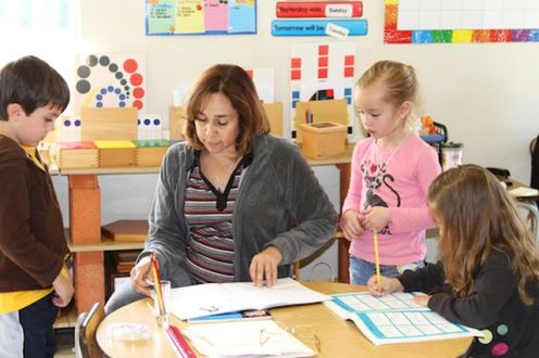 teacher-working-with-3-children