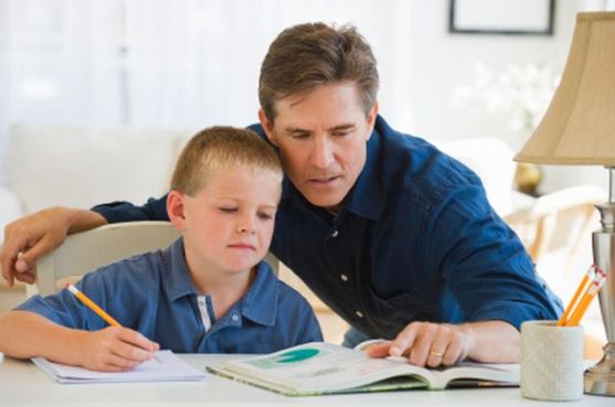 Father helping his son with homework