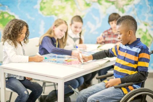 Children Coloring a World Map
